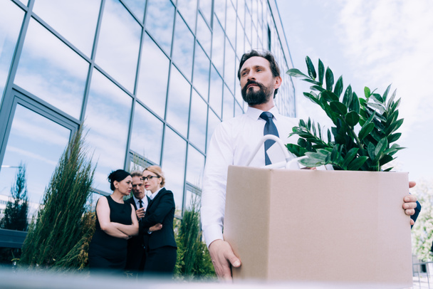 fired businessman with cardboard box  - Photo, Image