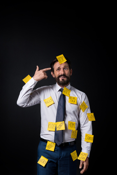 stressed businessman with sticky notes - Фото, зображення