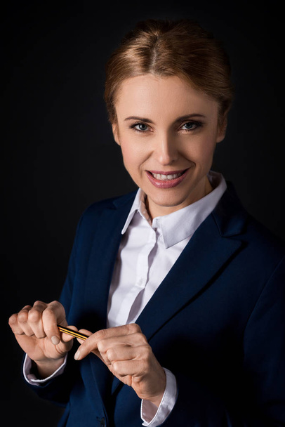 confident businesswoman holding pencil - Photo, image