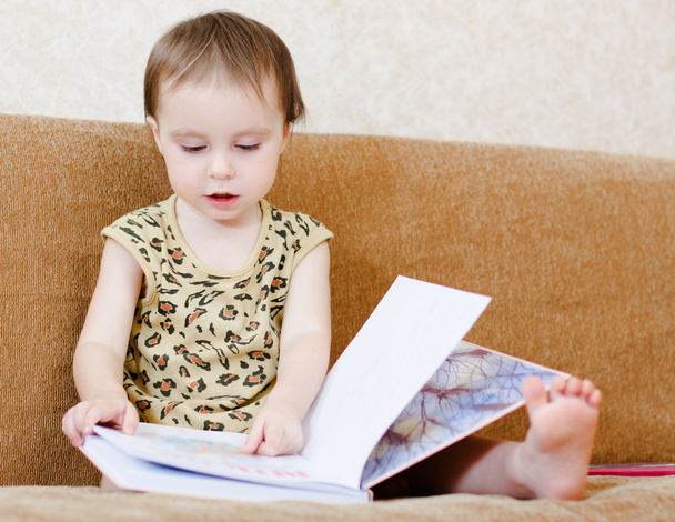 Beautiful cute baby reading a book - Valokuva, kuva