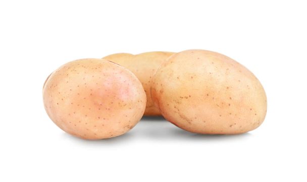 Raaka kuorimattomat perunat valkoisella pohjalla
 - Valokuva, kuva