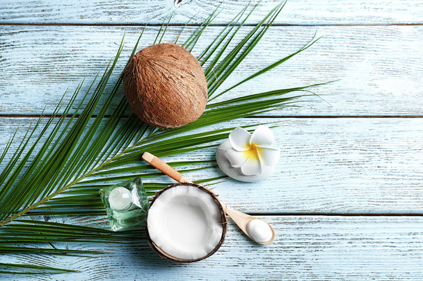 Set for spa treatment with coconut on wooden background - 写真・画像