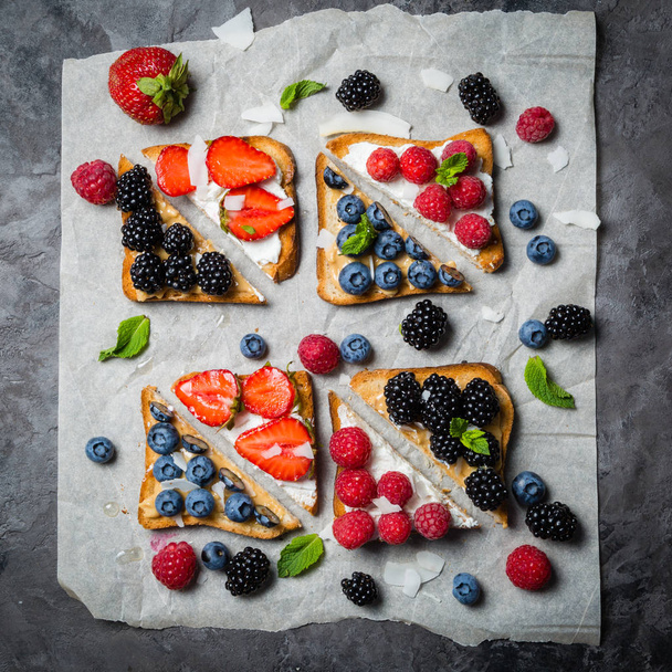 Selection of toasts with cheese peanut butter and berries - Foto, immagini