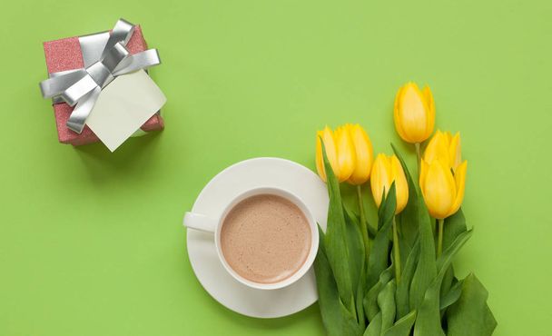 tulips on table with cup of coffee - Valokuva, kuva