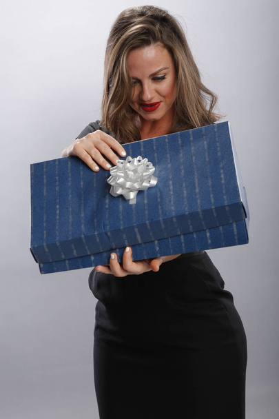 Young woman gets a gift - Фото, зображення
