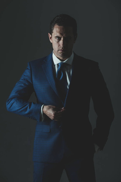 man with serious face and stylish hair in suit - Фото, зображення