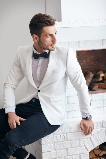 Handsome man in white elegant suit - 写真・画像
