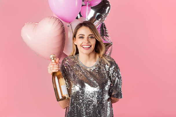 Charming woman with champagne and balloons - Foto, afbeelding