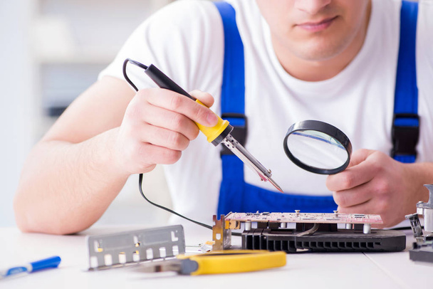 Computer repairman repairing desktop computer - Photo, Image