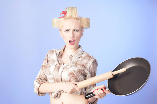 Funny housewife with roller-pin and pan - Photo, Image