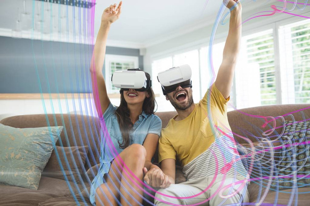 Happy couple in VR headset looking to lights interfaces - Zdjęcie, obraz