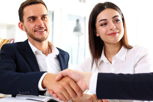 Smiling man in suit shake hands as hello in office - Photo, Image