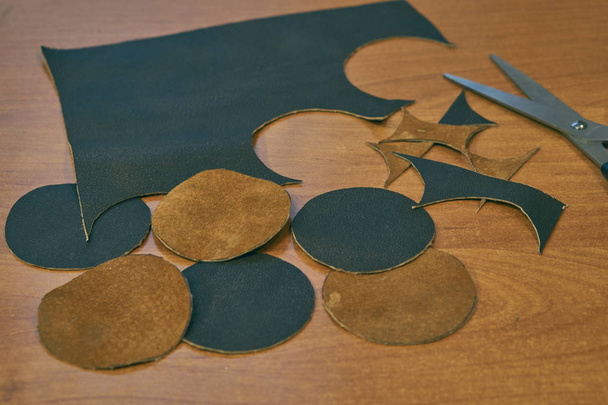 pieces of brown leather on a desk - Fotoğraf, Görsel