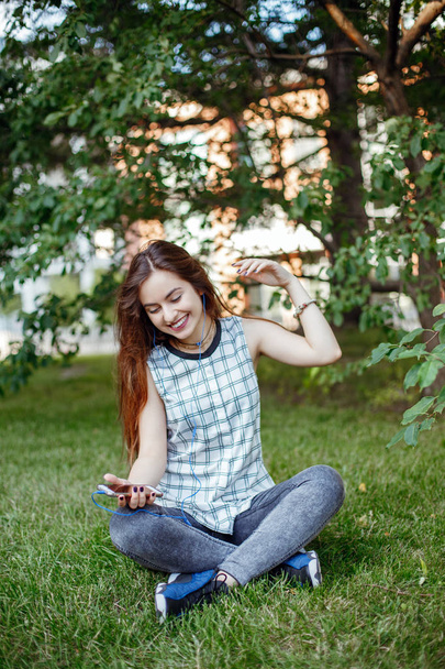 woman  listening to music  in park  - Photo, Image