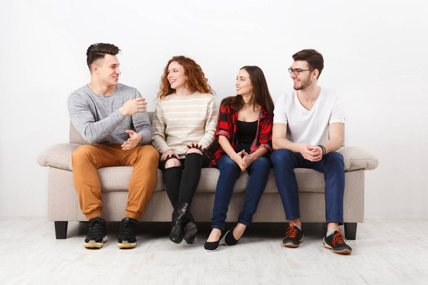 Happy young friends, casual people sitting on couch - Photo, image