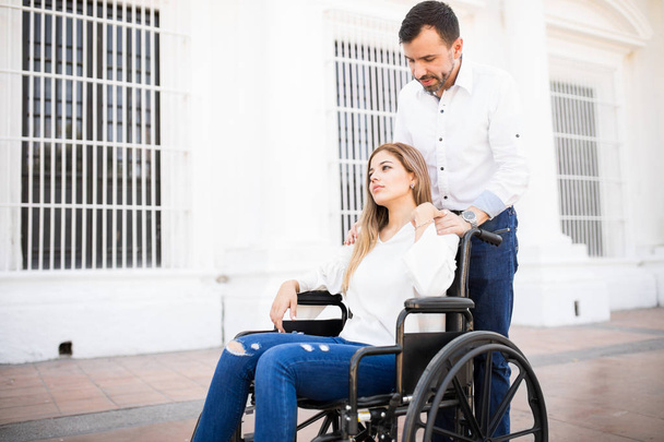 車椅子で悲しい麻痺女性 - 写真・画像