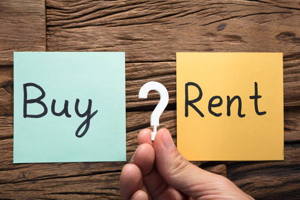Question Mark Amidst Buy And Rent  - Foto, Imagem