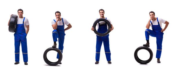 Handsome tyre repairman isolated on white - Photo, Image