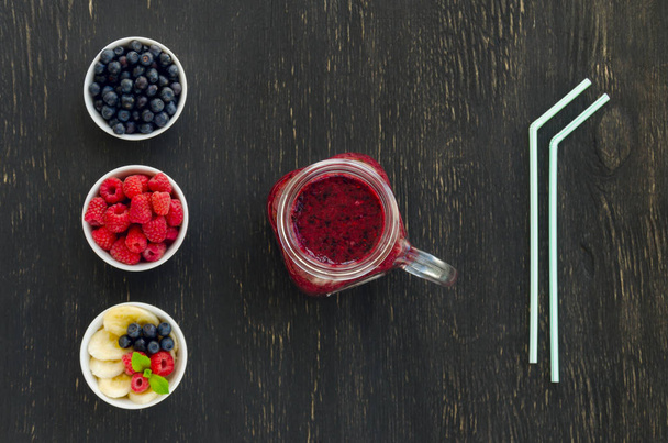 Smoothie with blueberries, banana and raspberries in jar - Фото, зображення