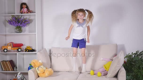 Happy children jumping on the bed and having fun. slow motion - Filmmaterial, Video