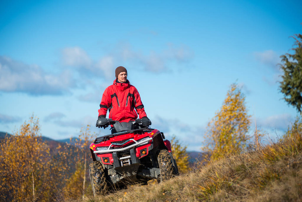 guy on the red ATV quad  - Photo, Image
