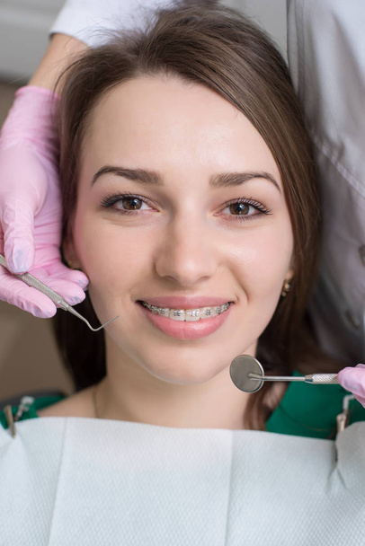 happy female patient with metal braces - Foto, Imagem