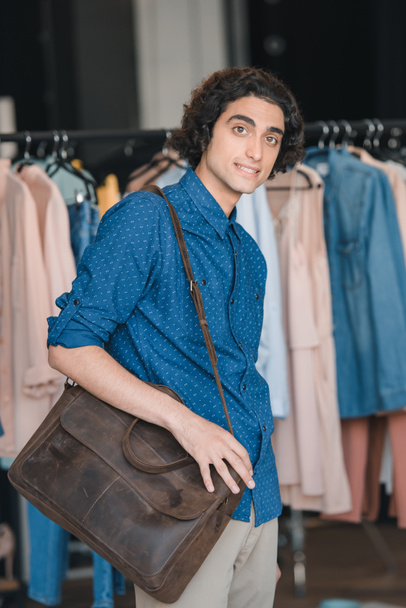 man with shoulder bag shopping - Photo, Image