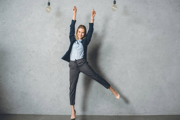 happy businesswoman in suit - Photo, Image