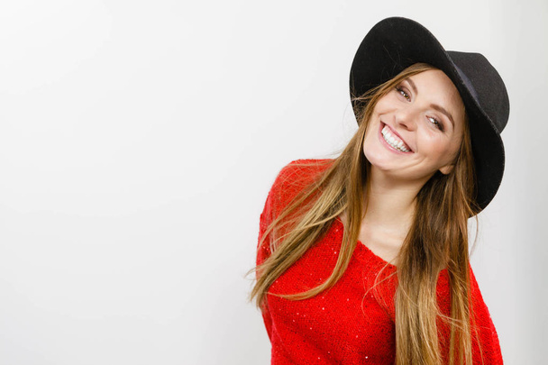 Smiling pretty girl with brown hair and black hat. - Fotografie, Obrázek