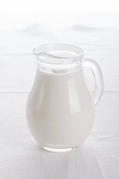 Glass jug and glass with milk - Fotoğraf, Görsel
