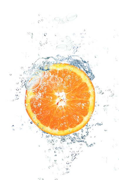fresh orange falling in water - Foto, Imagen
