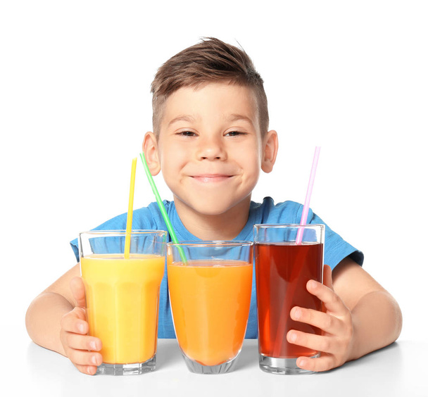 Cute little boy with glasses of juice  - Fotó, kép