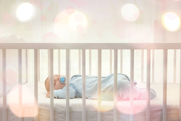 Lovely baby sleeping in cradle  - 写真・画像