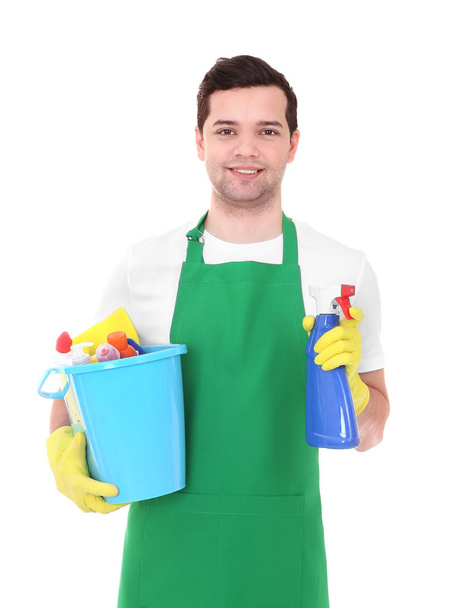 Young man with cleaning products on white background - Valokuva, kuva