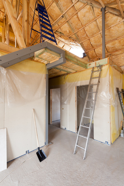 A room at a newly constructed home is sprayed with liquid insulating foam. - Photo, Image