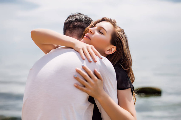 couple hugging on sea coast - Foto, immagini