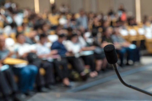 Microphone over blurred conference hall - Photo, Image