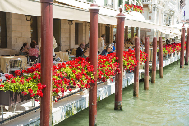 tourists sitting in Venice  restaurant  - Photo, Image