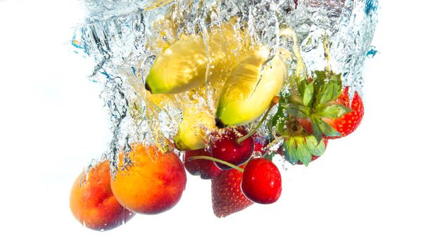fruits falling in water - Photo, Image