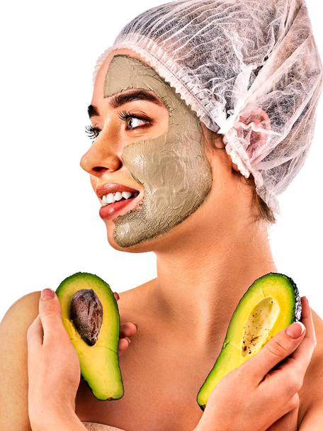 Mud facial mask of woman in spa salon. Face massage . - Foto, afbeelding