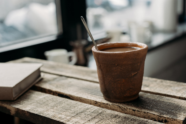  Clay cup of coffee with milk  - Φωτογραφία, εικόνα