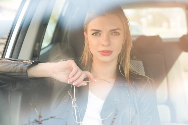 beautiful blond woman in car - Photo, Image