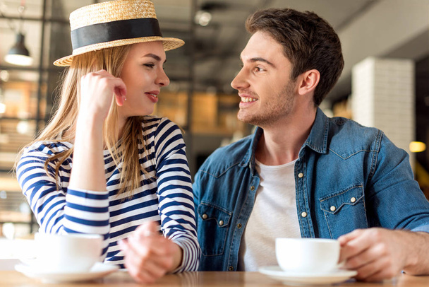 couple drinking coffee in cafe - Foto, Imagen