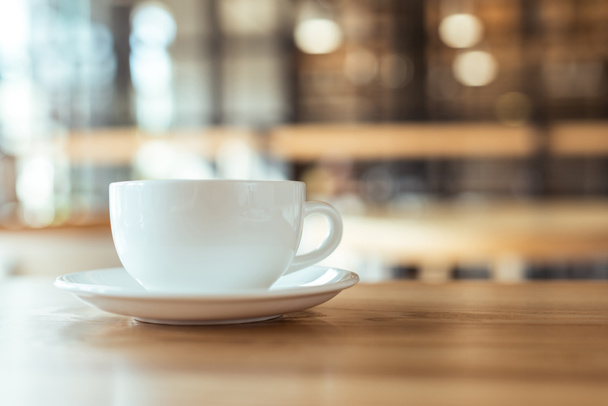 cup of coffee on table in coffee shop - Photo, Image