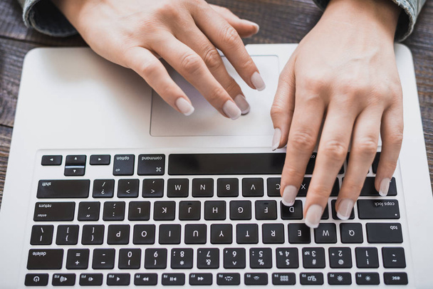 Morning business woman. Female hands working on a laptop, close-up. Horizontal frame - Fotó, kép