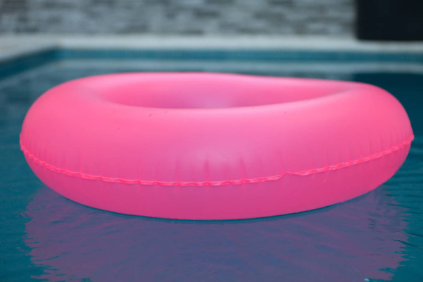 Pink float on pool  - 写真・画像