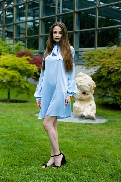 young woman in blue dress  - Fotó, kép