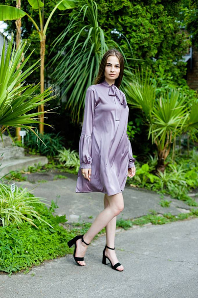 young woman in purple dress - Fotó, kép