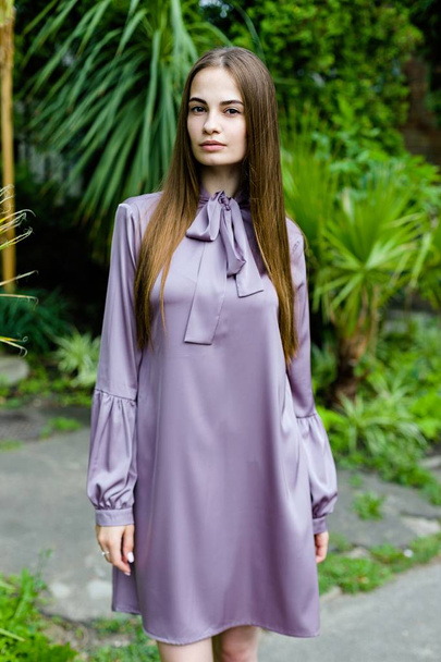young woman in purple dress - Foto, Imagen
