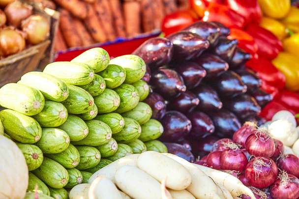 market with various colorful fresh fruits and vegetables - Foto, Imagem